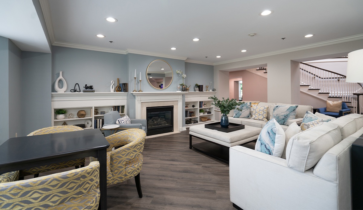 living room featuring a fireplace and a wooden table
