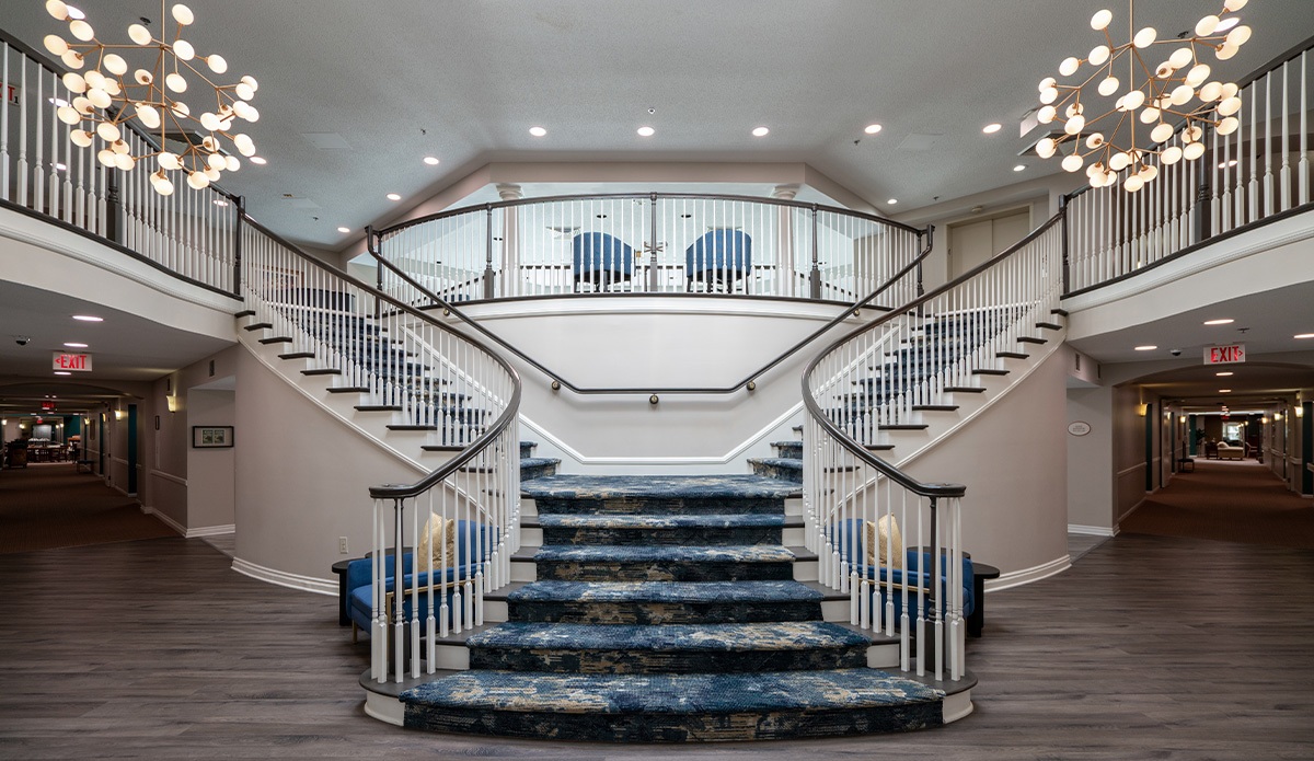 lobby entrance features a welcoming staircase leading up to the main area of the building.