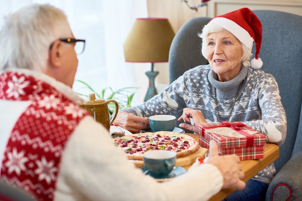 Senior couple enjoying the holidays indoors at their retirement community Michigan